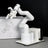 JetCobot is a white robotic arm made of plastic and aluminum alloy.