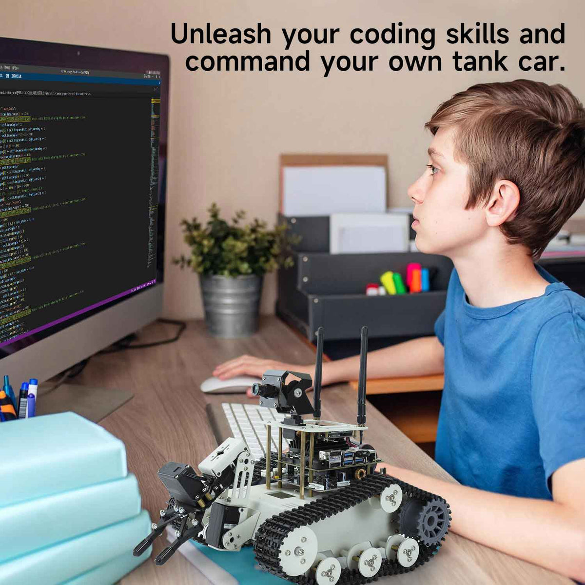 Teen boy in blue T-shirt shows coding skills on computer and commands Transbot SE